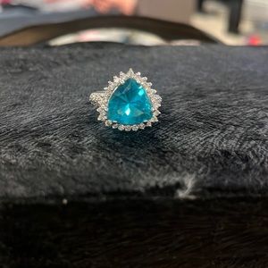 Costume jewelry blue topaz and rhinestone accent ring